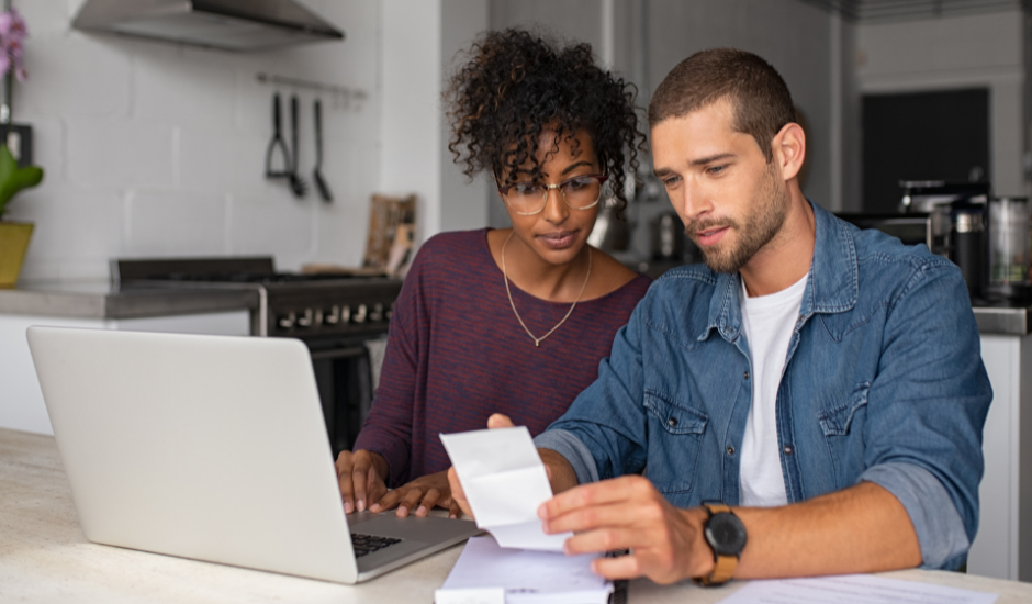 Couple Looking At Laptop To Open A Bank Account