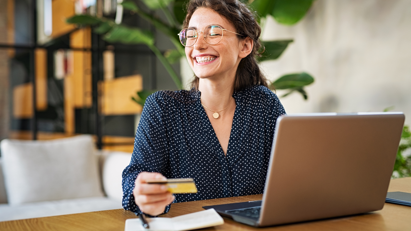 Woman With Laptop Using Credit Card
